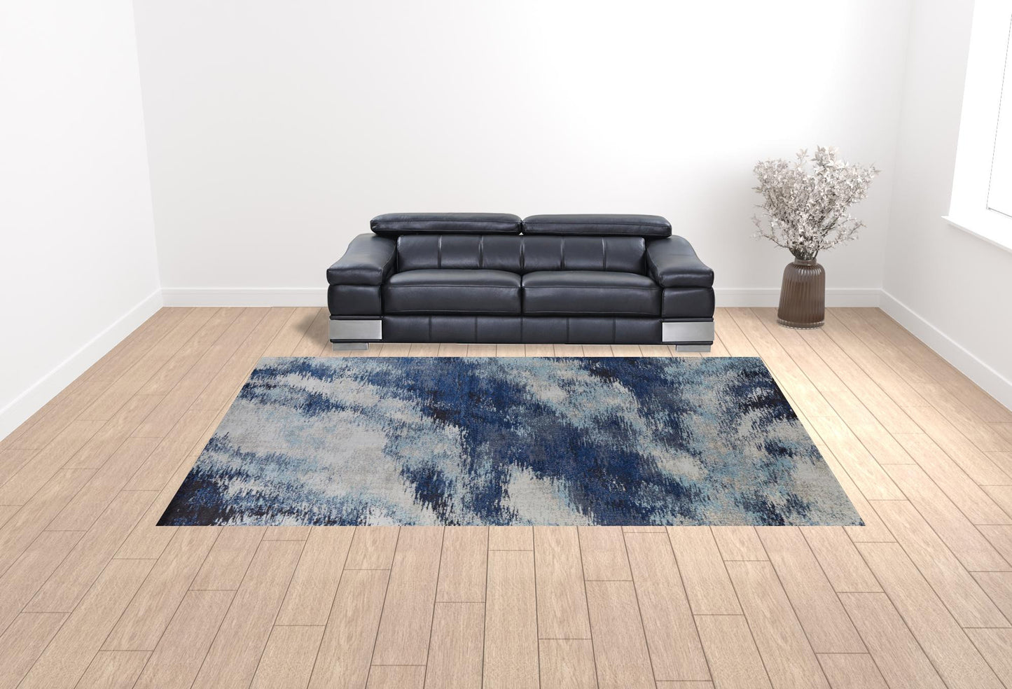 5' X 8' Blue And Ivory Abstract Power Loom Stain Resistant Area Rug