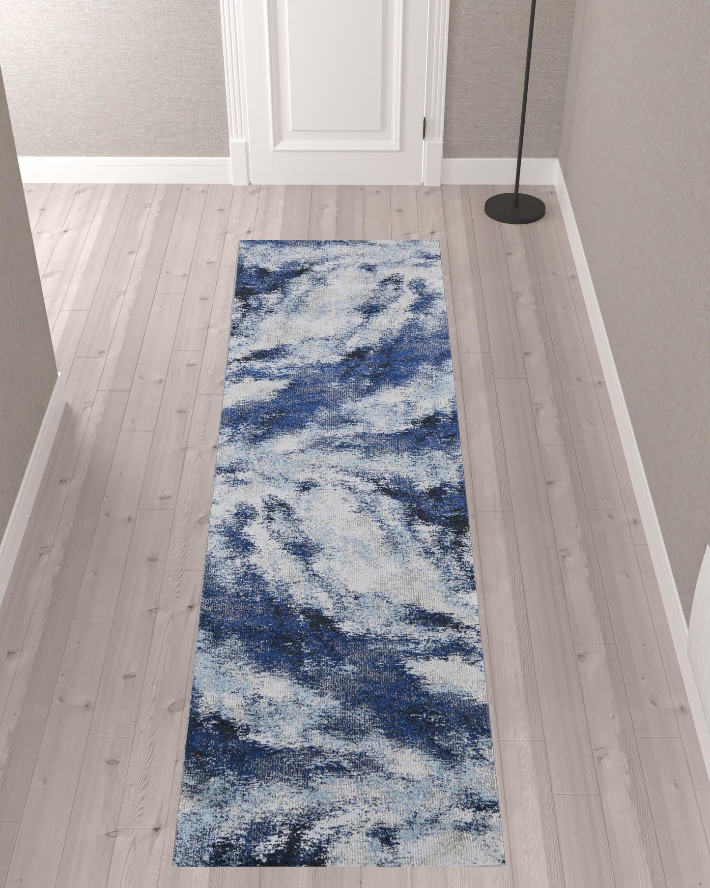 5' X 8' Blue And Ivory Abstract Power Loom Stain Resistant Area Rug