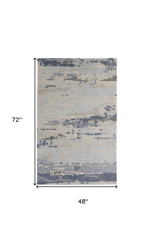 4' X 6' Blue Gray And Ivory Wool Abstract Tufted Handmade Stain Resistant Area Rug