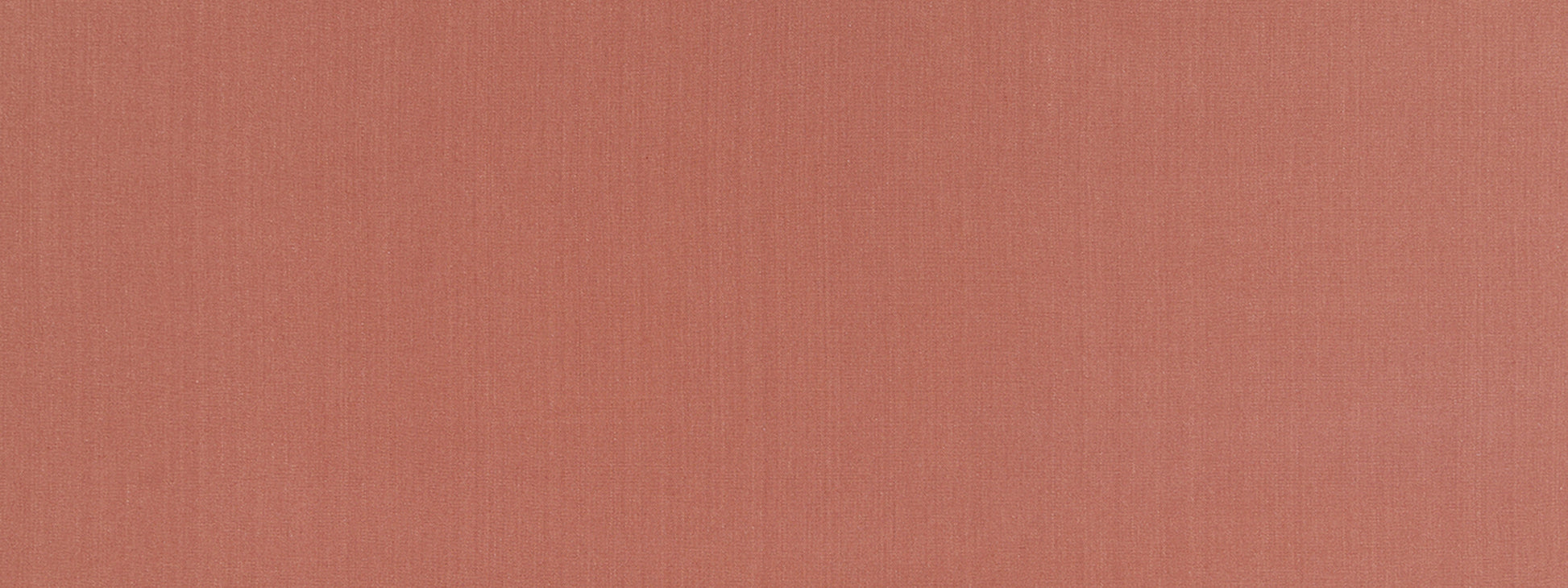 Peachy-coral fabric texture close-up; soft woven textile swatch in warm orange-pink.