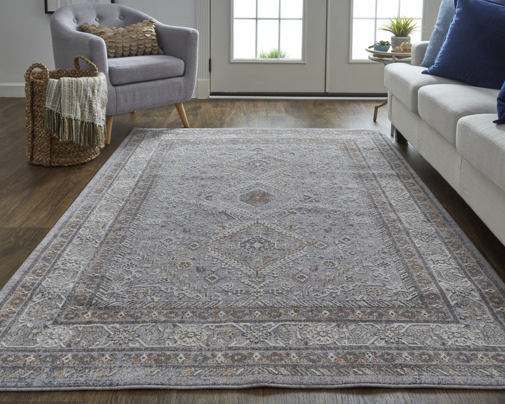 7' X 9' Gray Orange And Ivory Floral Power Loom Stain Resistant Area Rug