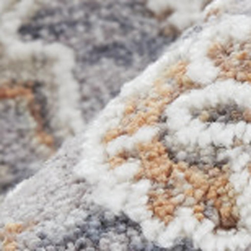 10' X 13' Gray Orange And Ivory Floral Power Loom Stain Resistant Area Rug