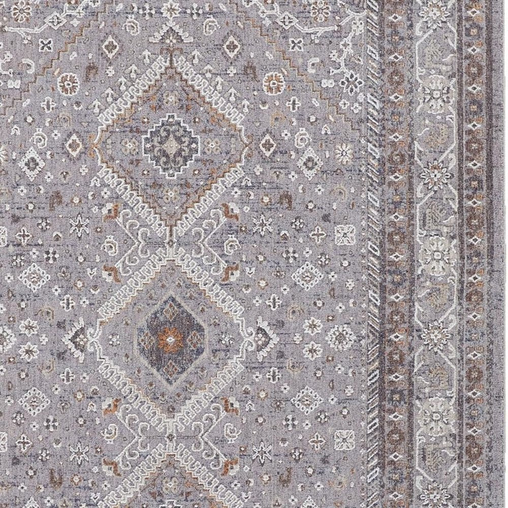 10' X 13' Gray Orange And Ivory Floral Power Loom Stain Resistant Area Rug