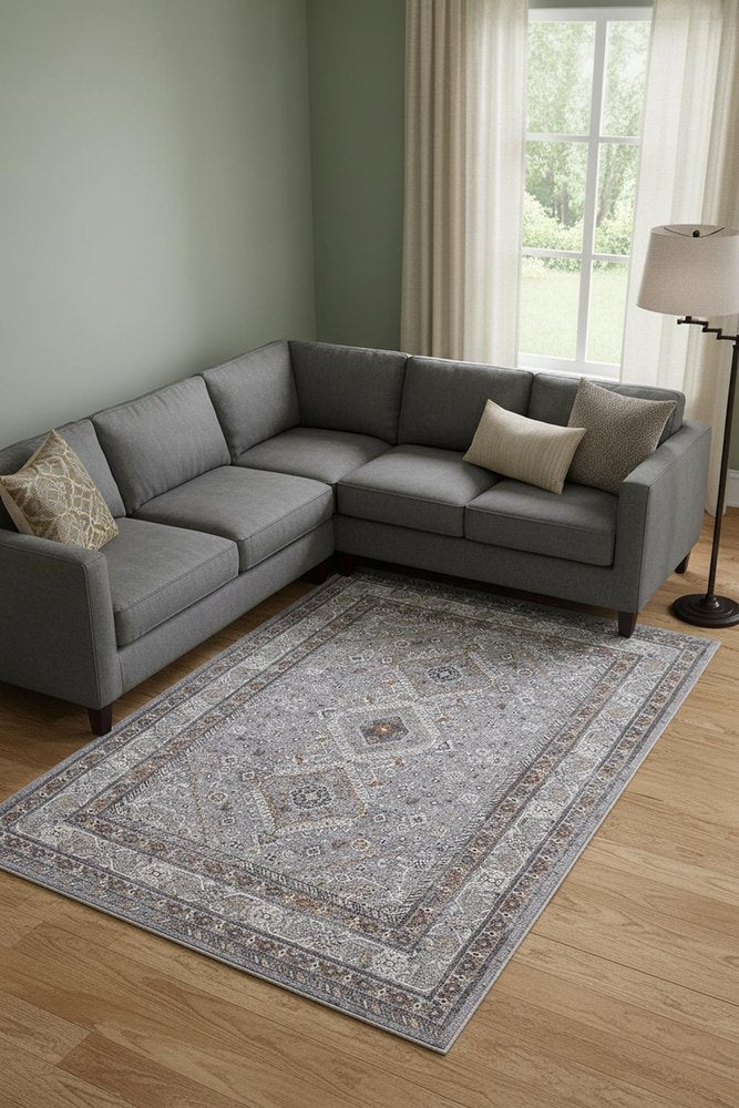 10' X 13' Gray Orange And Ivory Floral Power Loom Stain Resistant Area Rug