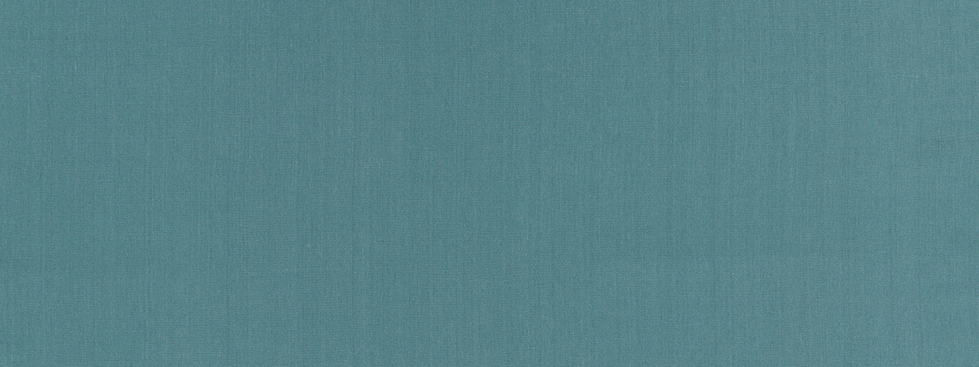 Teal textured fabric backdrop with a subtle weave.