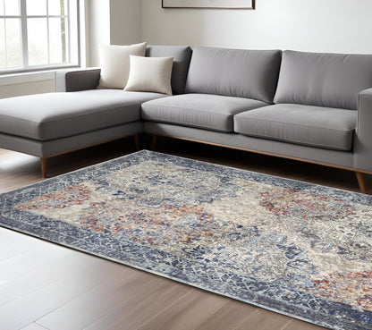 7' X 10' Blue and Ivory Floral Power Loom Distressed Non Skid Area Rug
