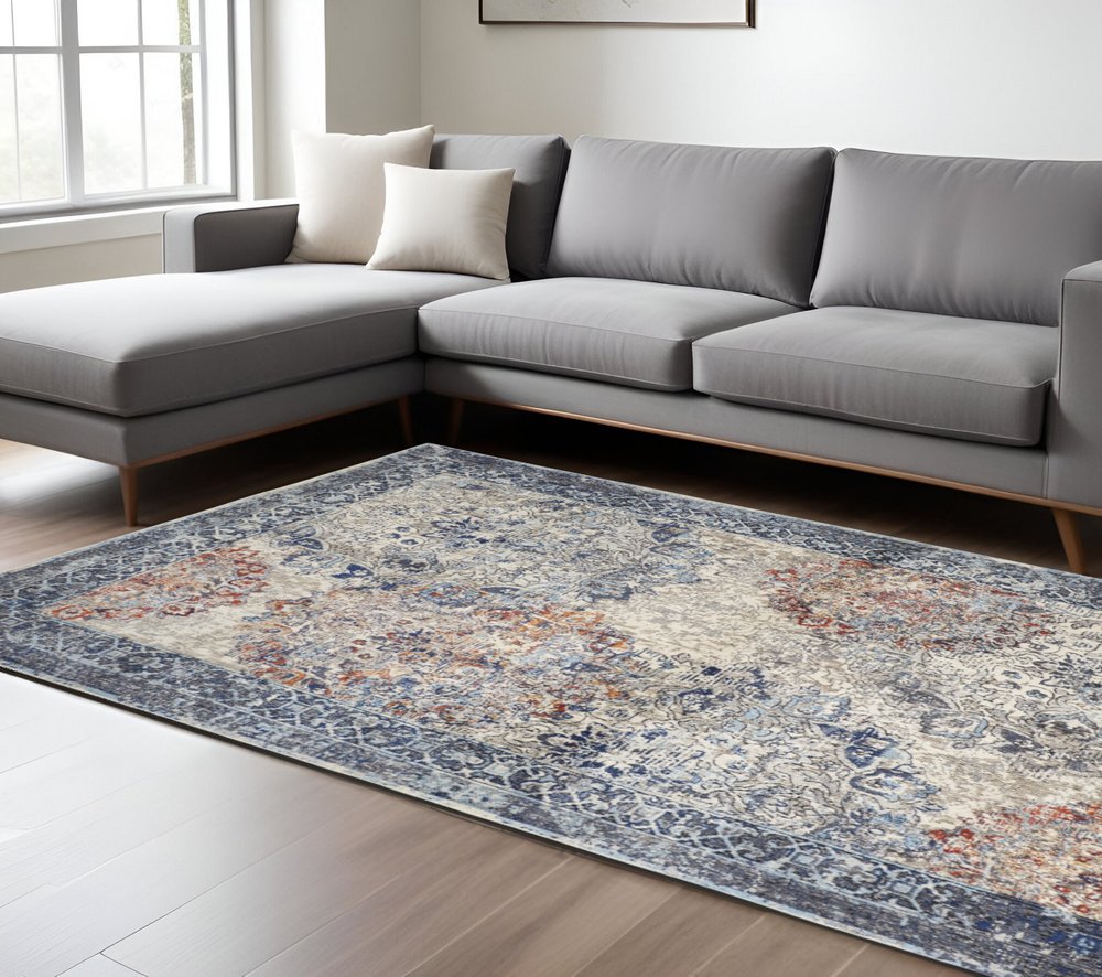 7' X 10' Blue and Ivory Floral Power Loom Distressed Non Skid Area Rug