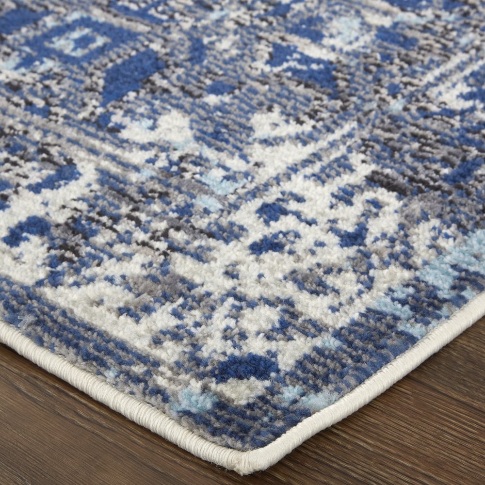 7' X 10' Blue and Ivory Floral Power Loom Distressed Non Skid Area Rug