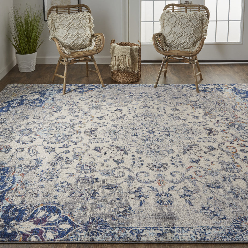 5' X 8' Ivory Gray And Blue Floral Power Loom Distressed Stain Resistant Area Rug