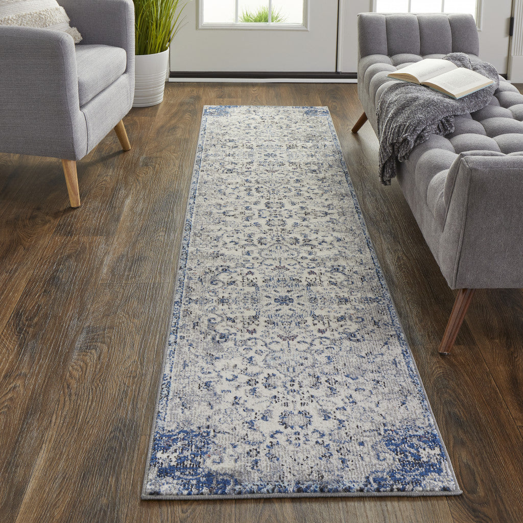 5' X 8' Ivory Gray And Blue Floral Power Loom Distressed Stain Resistant Area Rug