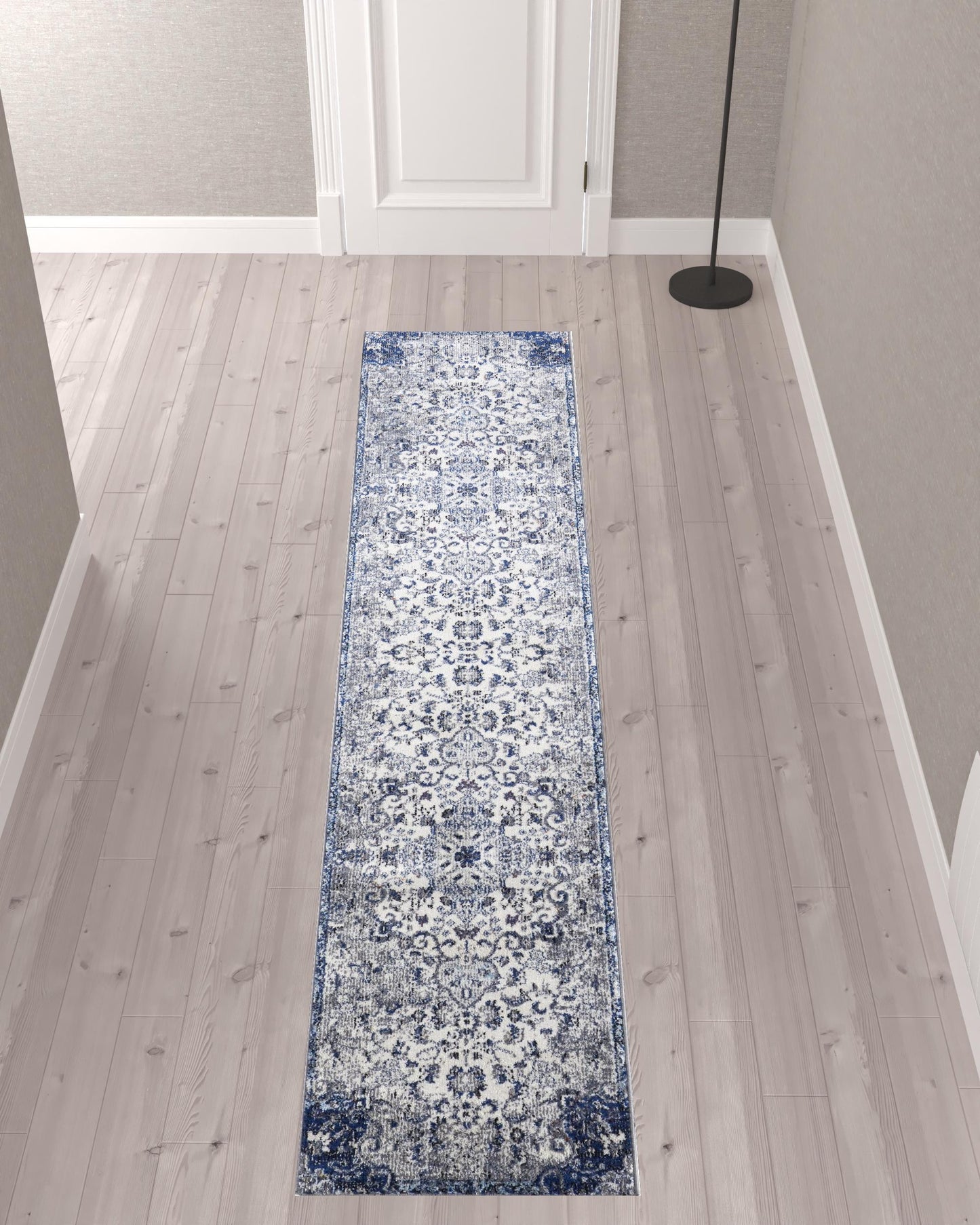 5' X 8' Ivory Gray And Blue Floral Power Loom Distressed Stain Resistant Area Rug