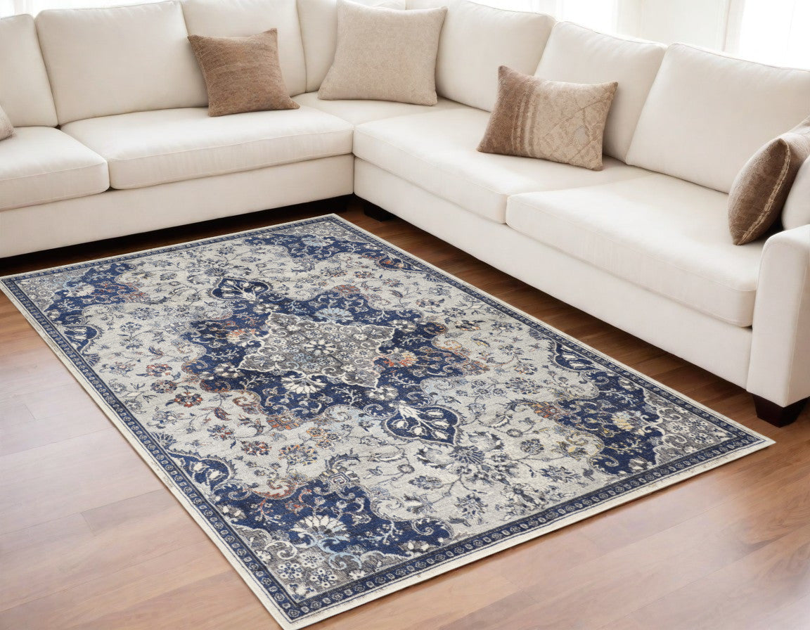 5' X 8' Gray Ivory And Blue Floral Power Loom Distressed Stain Resistant Area Rug