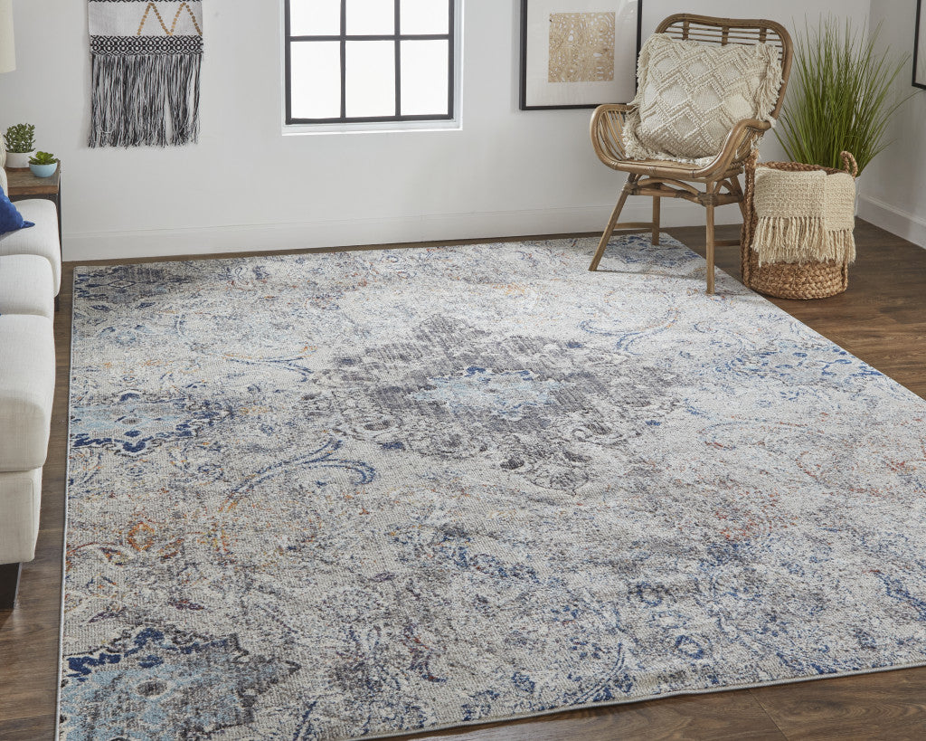 8' X 11' Ivory Taupe And Blue Floral Power Loom Distressed Stain Resistant Area Rug