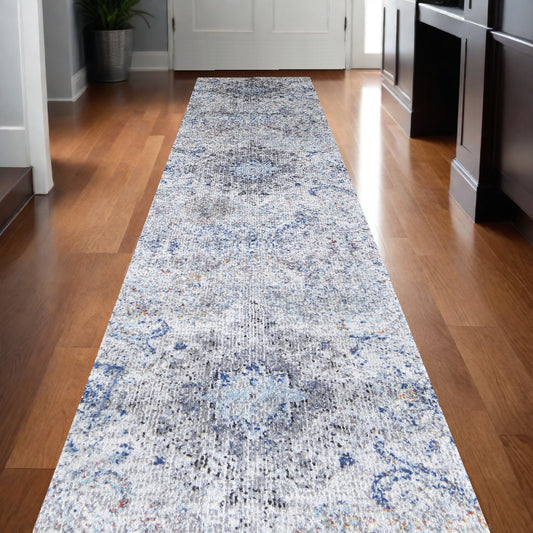 9' X 12' Ivory Taupe And Blue Floral Power Loom Distressed Stain Resistant Area Rug