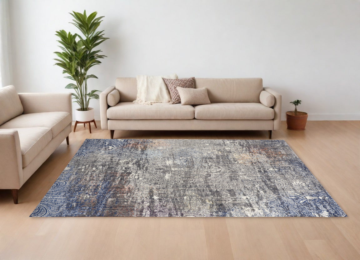 5' X 8' Taupe Blue And Ivory Abstract Power Loom Distressed Stain Resistant Area Rug