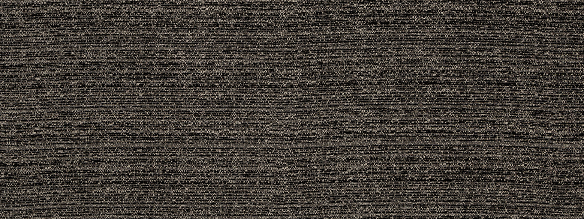 Dark brown and black speckled tweed fabric texture with dense weave, suitable for upholstery or garments.