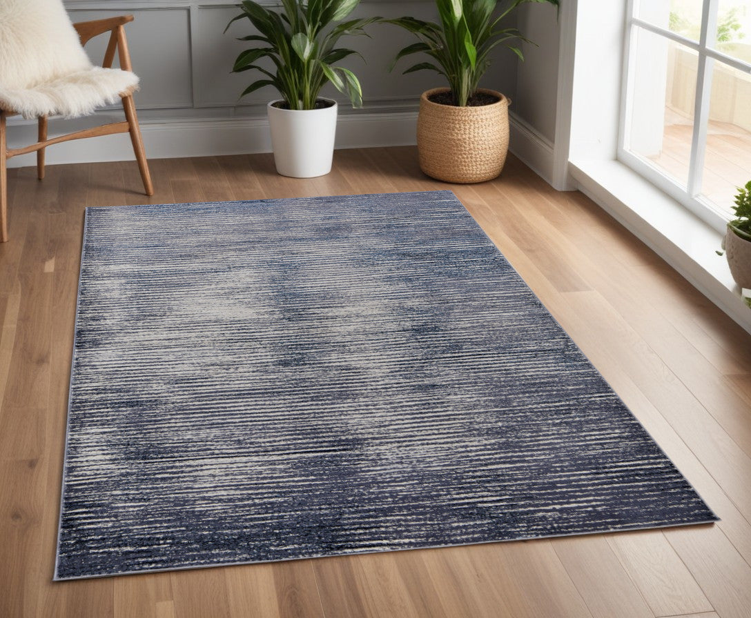 5' X 8' Blue and Ivory Striped Power Loom Distressed Non Skid Area Rug