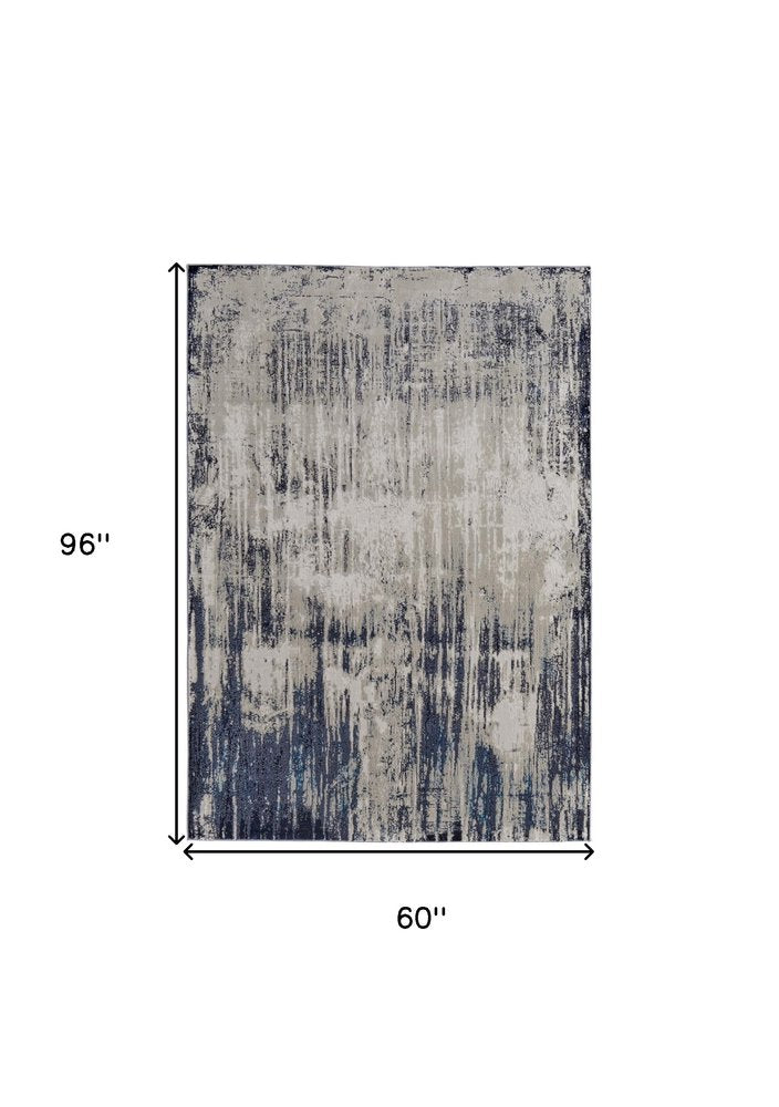 8' X 10' Tan and Blue Abstract Power Loom Distressed Non Skid Area Rug