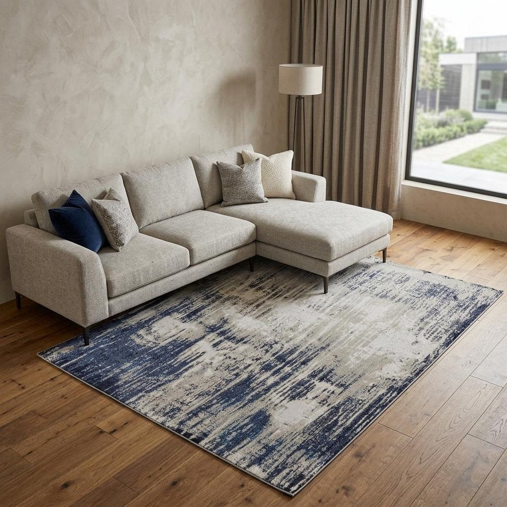 4' X 6' Tan Blue And Ivory Abstract Power Loom Distressed Area Rug