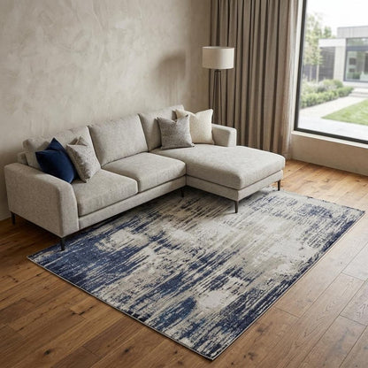 4' X 6' Tan Blue And Ivory Abstract Power Loom Distressed Area Rug
