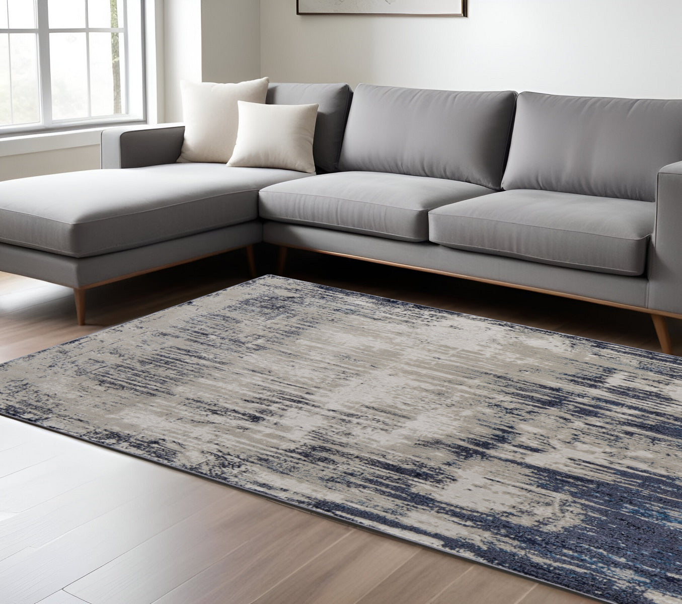 4' X 6' Tan Blue And Ivory Abstract Power Loom Distressed Area Rug