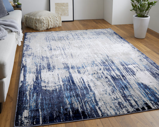 4' X 6' Tan Blue And Ivory Abstract Power Loom Distressed Area Rug