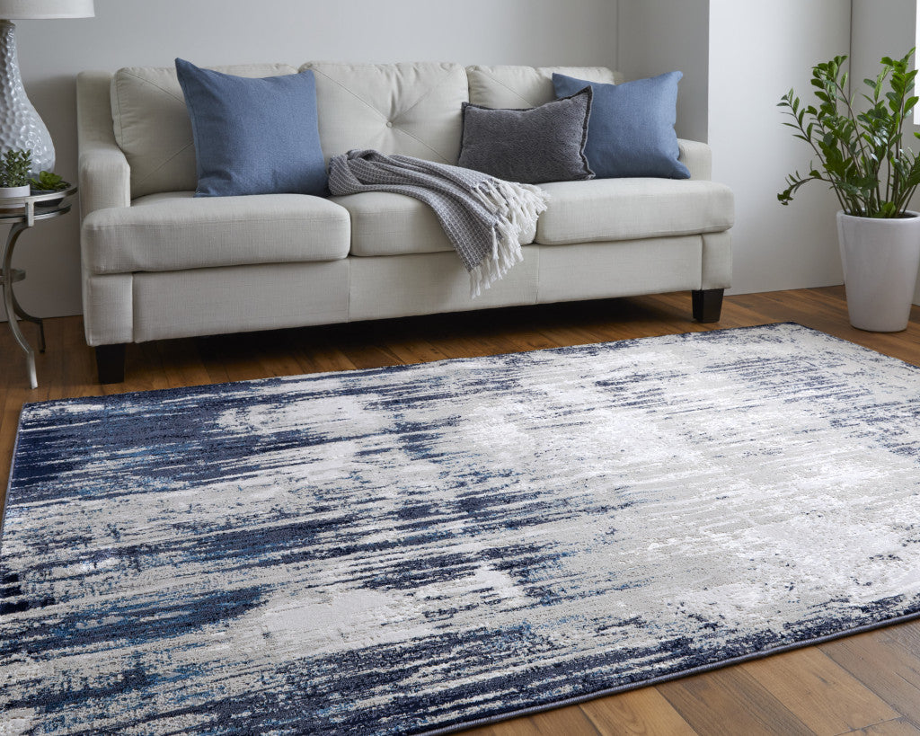 4' X 6' Tan Blue And Ivory Abstract Power Loom Distressed Area Rug