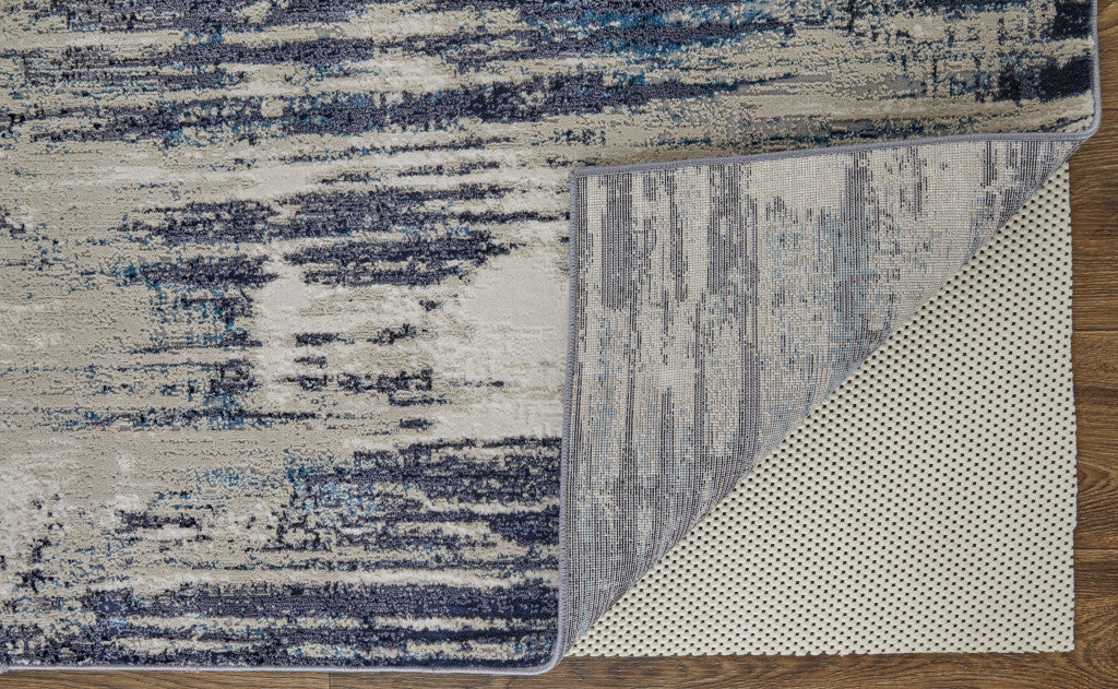 4' X 6' Tan Blue And Ivory Abstract Power Loom Distressed Area Rug