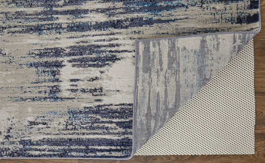 5' X 8' Tan Blue And Ivory Abstract Power Loom Distressed Area Rug