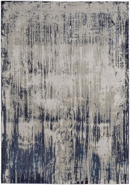 4' X 6' Tan Blue And Ivory Abstract Power Loom Distressed Area Rug