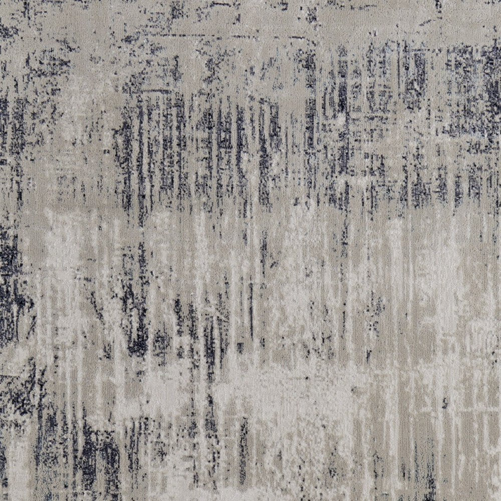 4' X 6' Tan Blue And Ivory Abstract Power Loom Distressed Area Rug