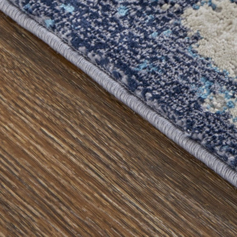 4' X 6' Tan Blue And Ivory Abstract Power Loom Distressed Area Rug