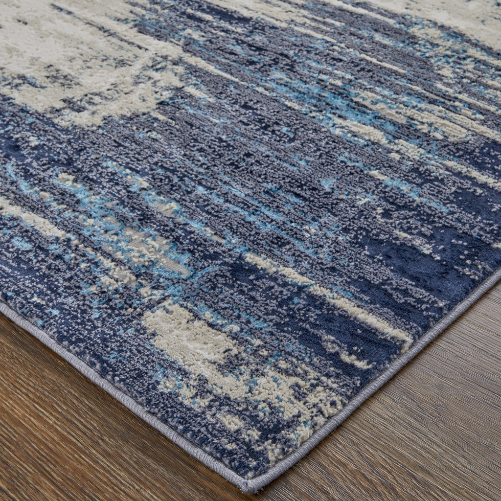 4' X 6' Tan Blue And Ivory Abstract Power Loom Distressed Area Rug