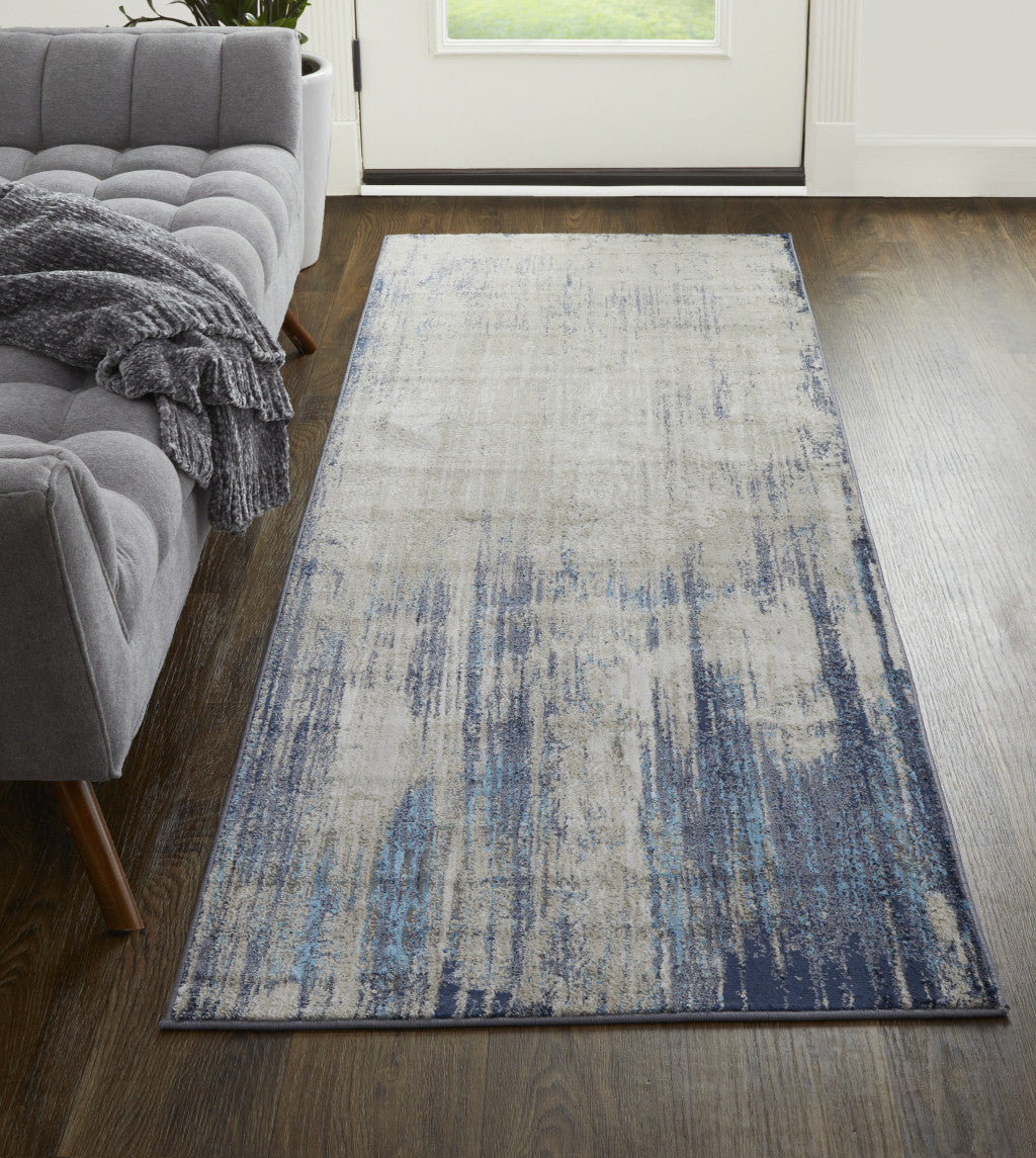 4' X 6' Tan Blue And Ivory Abstract Power Loom Distressed Area Rug