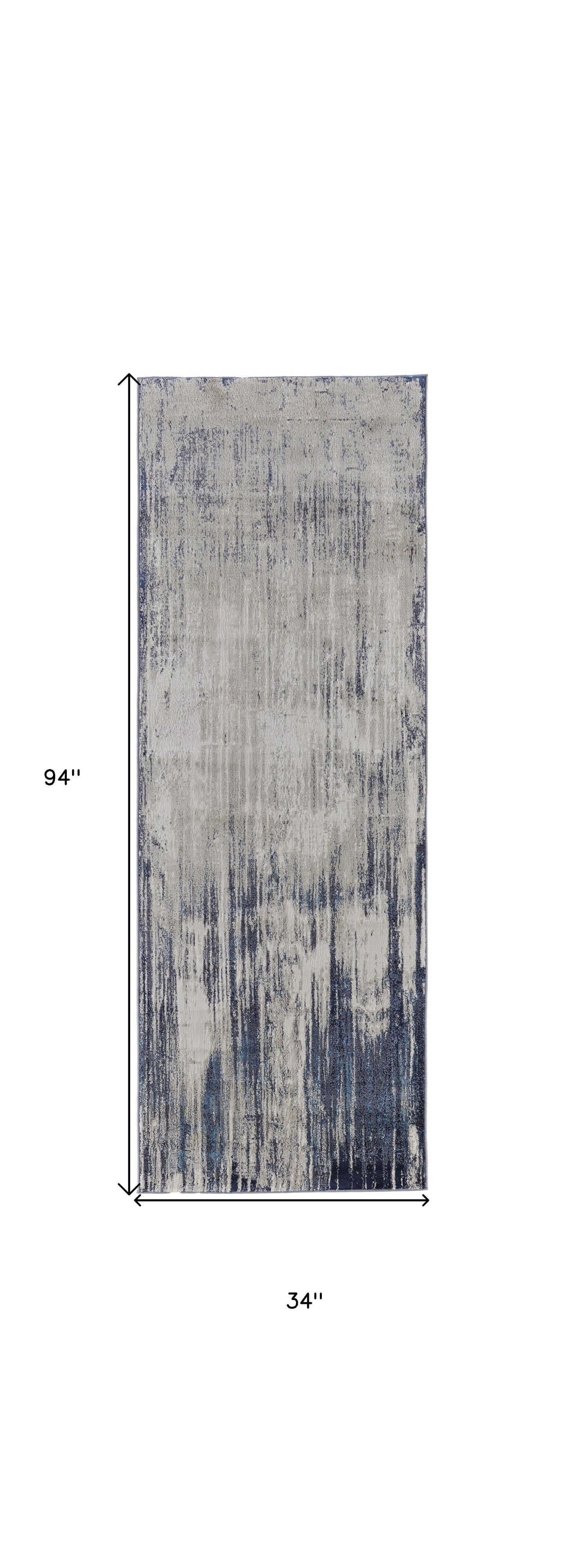 9' X 12' Tan Blue And Ivory Abstract Power Loom Distressed Area Rug