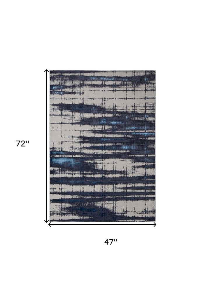 7' X 10' Ivory and Blue Abstract Power Loom Distressed Non Skid Area Rug