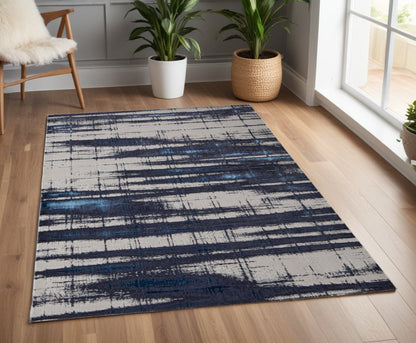 7' X 10' Ivory and Blue Abstract Power Loom Distressed Non Skid Area Rug