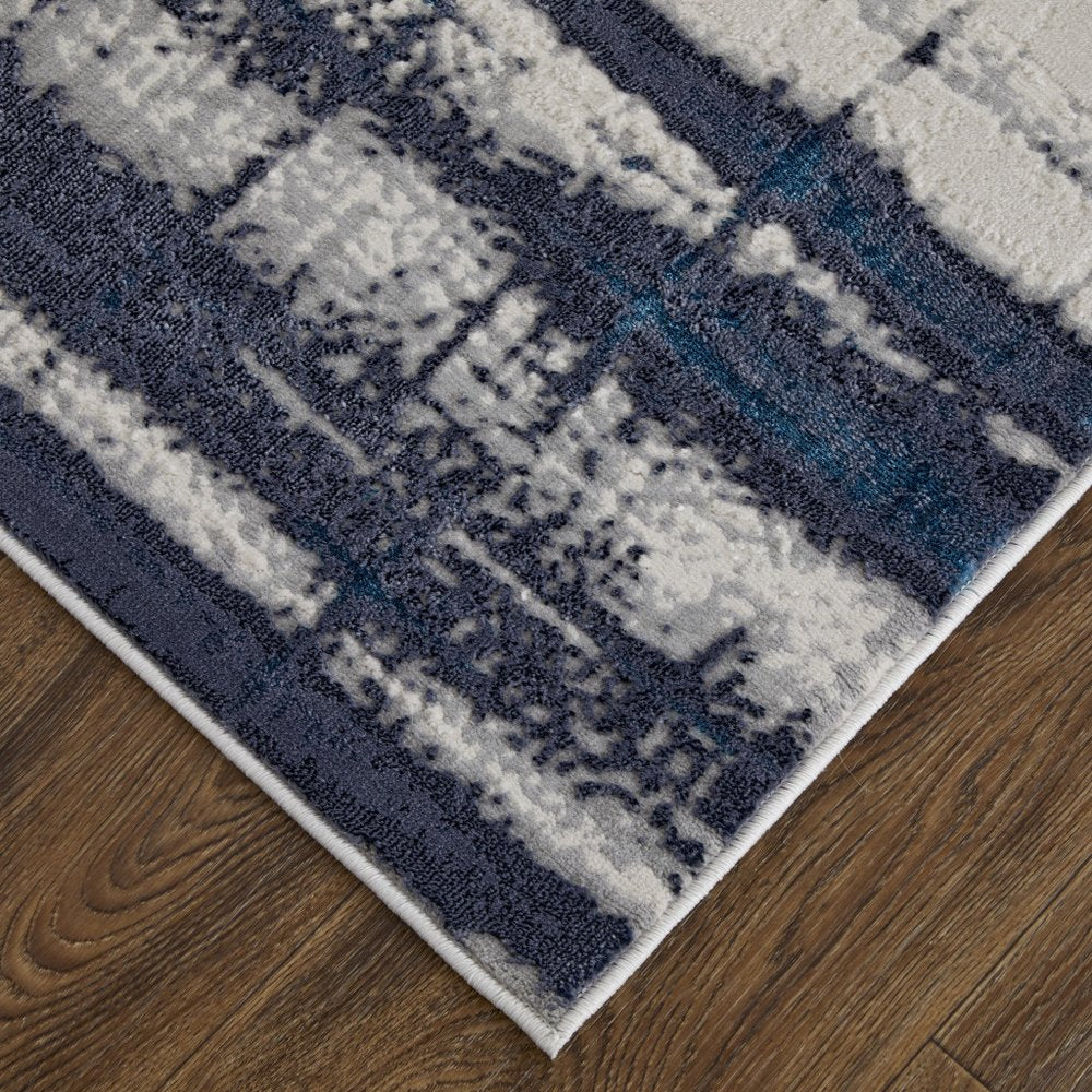 7' X 10' Ivory and Blue Abstract Power Loom Distressed Non Skid Area Rug