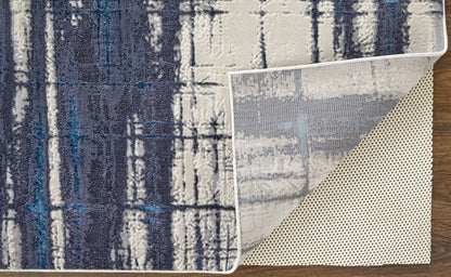 7' X 10' Ivory and Blue Abstract Power Loom Distressed Non Skid Area Rug