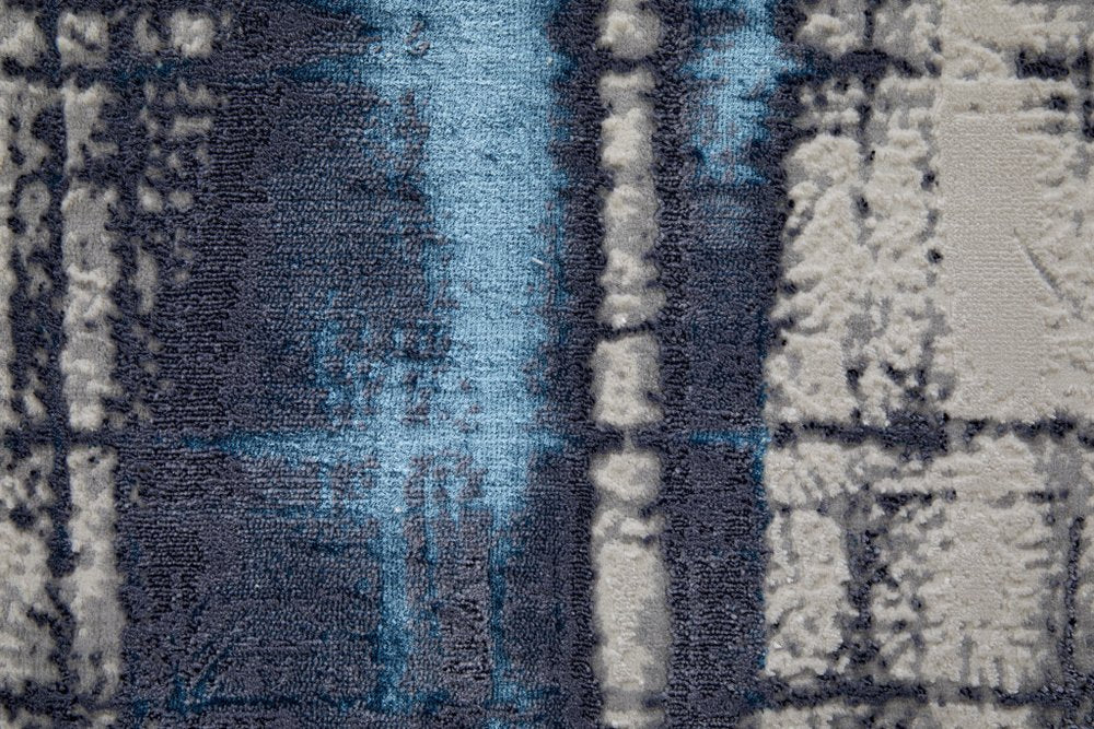 7' X 10' Ivory and Blue Abstract Power Loom Distressed Non Skid Area Rug
