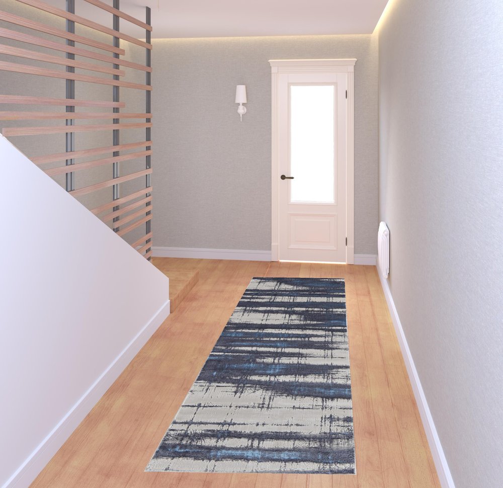 7' X 10' Ivory and Blue Abstract Power Loom Distressed Non Skid Area Rug