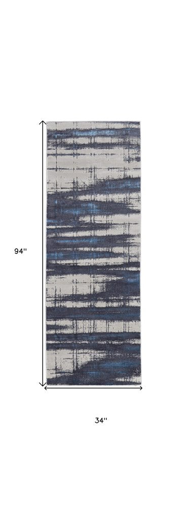 7' X 10' Ivory and Blue Abstract Power Loom Distressed Non Skid Area Rug