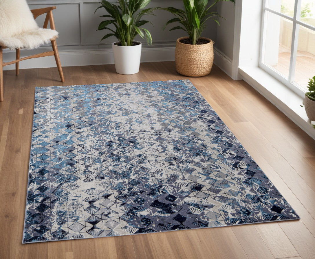 5' X 8' Blue Ivory And Gray Geometric Power Loom Distressed Area Rug