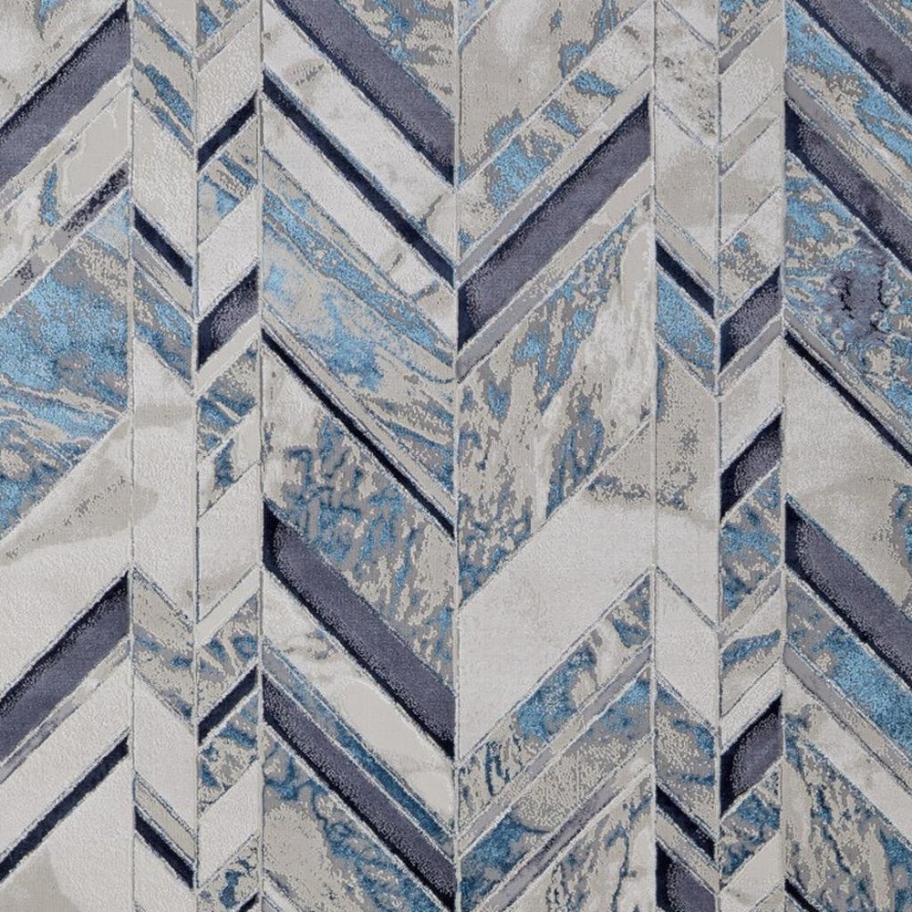 5' X 8' Ivory Blue And Gray Chevron Power Loom Distressed Area Rug