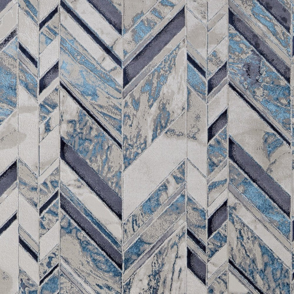 5' X 8' Ivory Blue And Gray Chevron Power Loom Distressed Area Rug