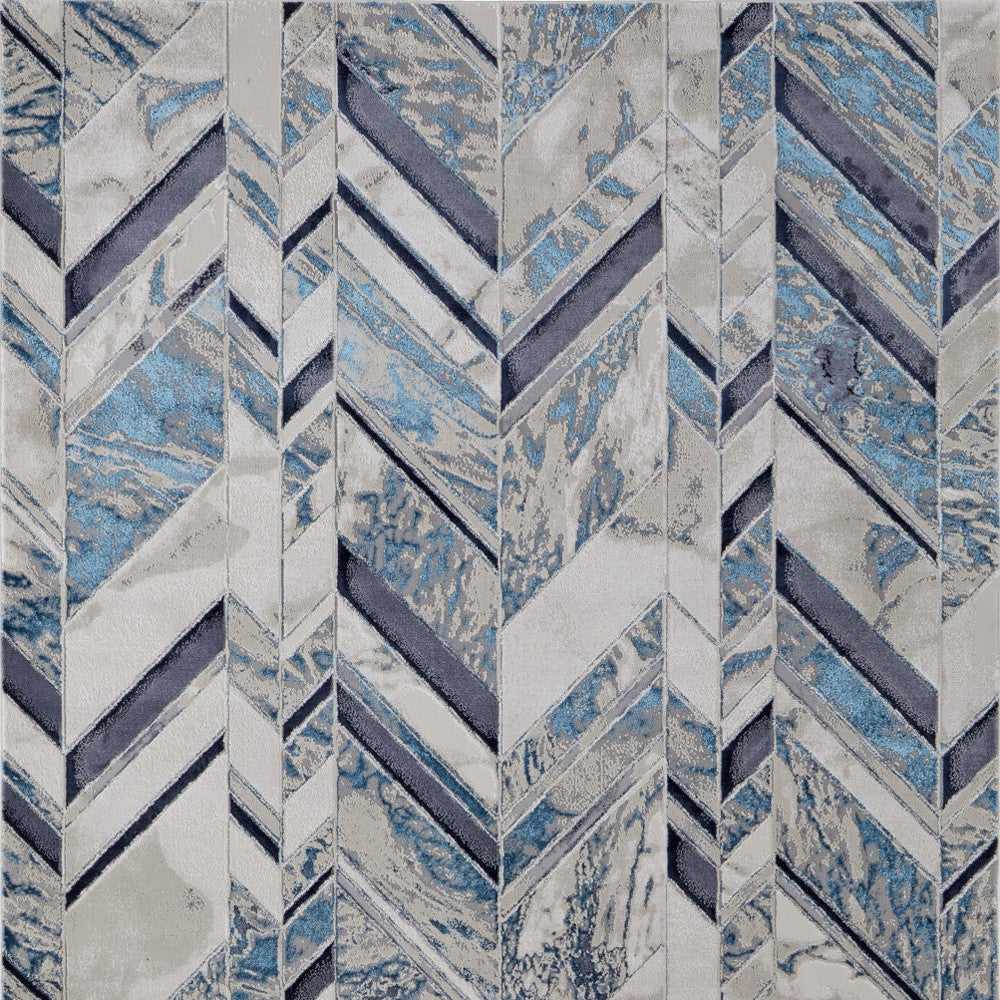 5' X 8' Ivory Blue And Gray Chevron Power Loom Distressed Area Rug