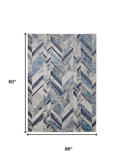 5' X 8' Ivory Blue And Gray Chevron Power Loom Distressed Area Rug