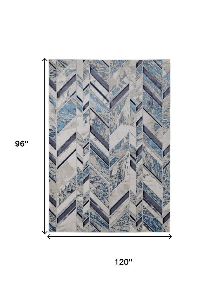 5' X 8' Ivory Blue And Gray Chevron Power Loom Distressed Area Rug