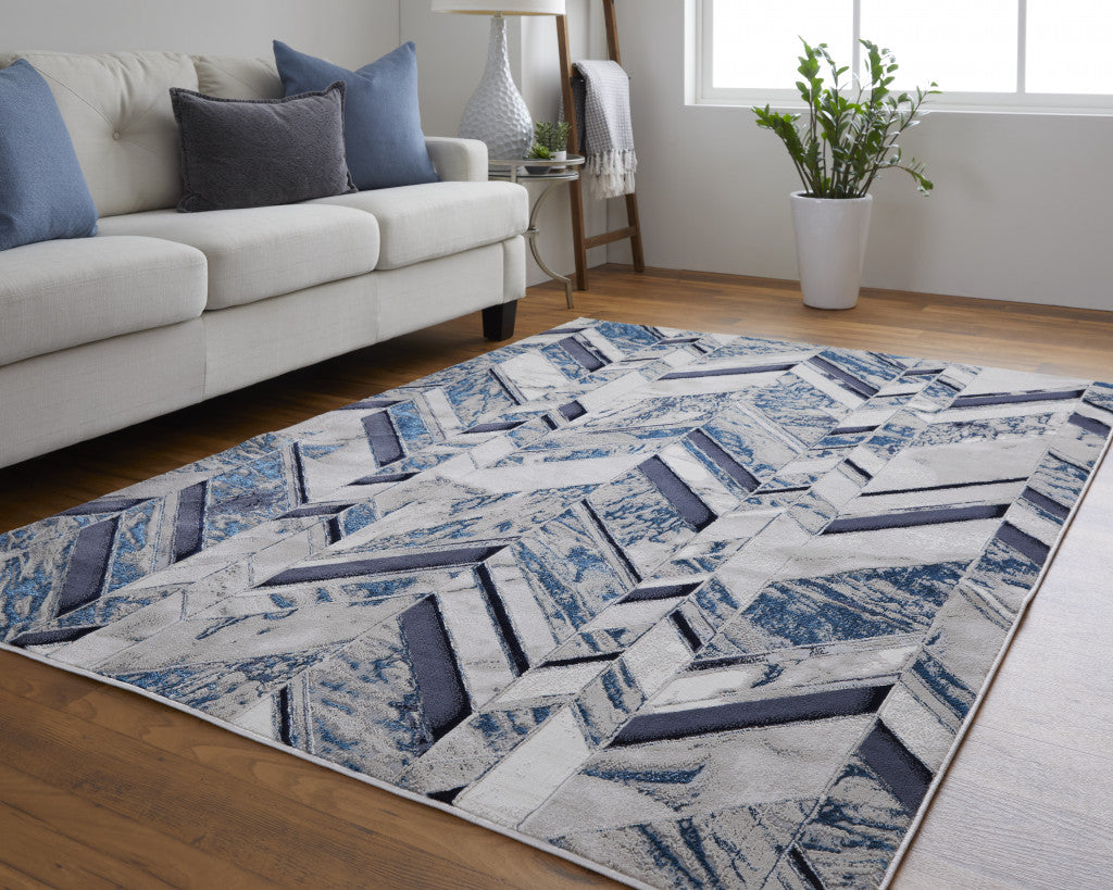 5' X 8' Ivory Blue And Gray Chevron Power Loom Distressed Area Rug