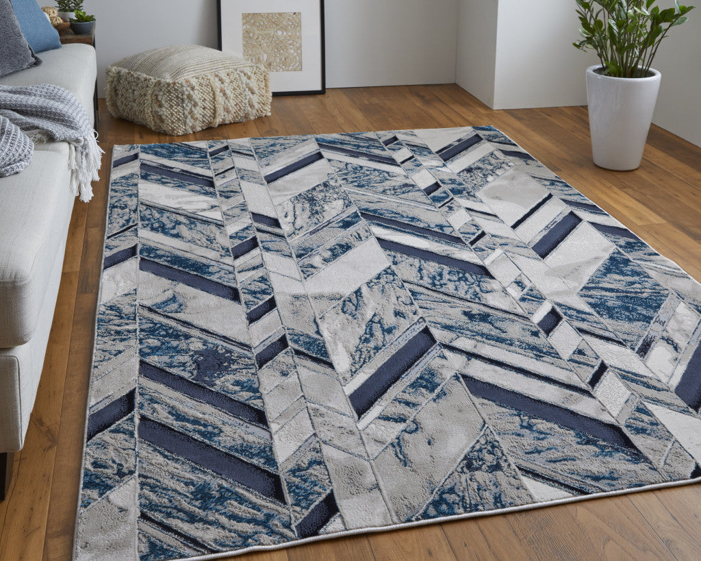 5' X 8' Ivory Blue And Gray Chevron Power Loom Distressed Area Rug